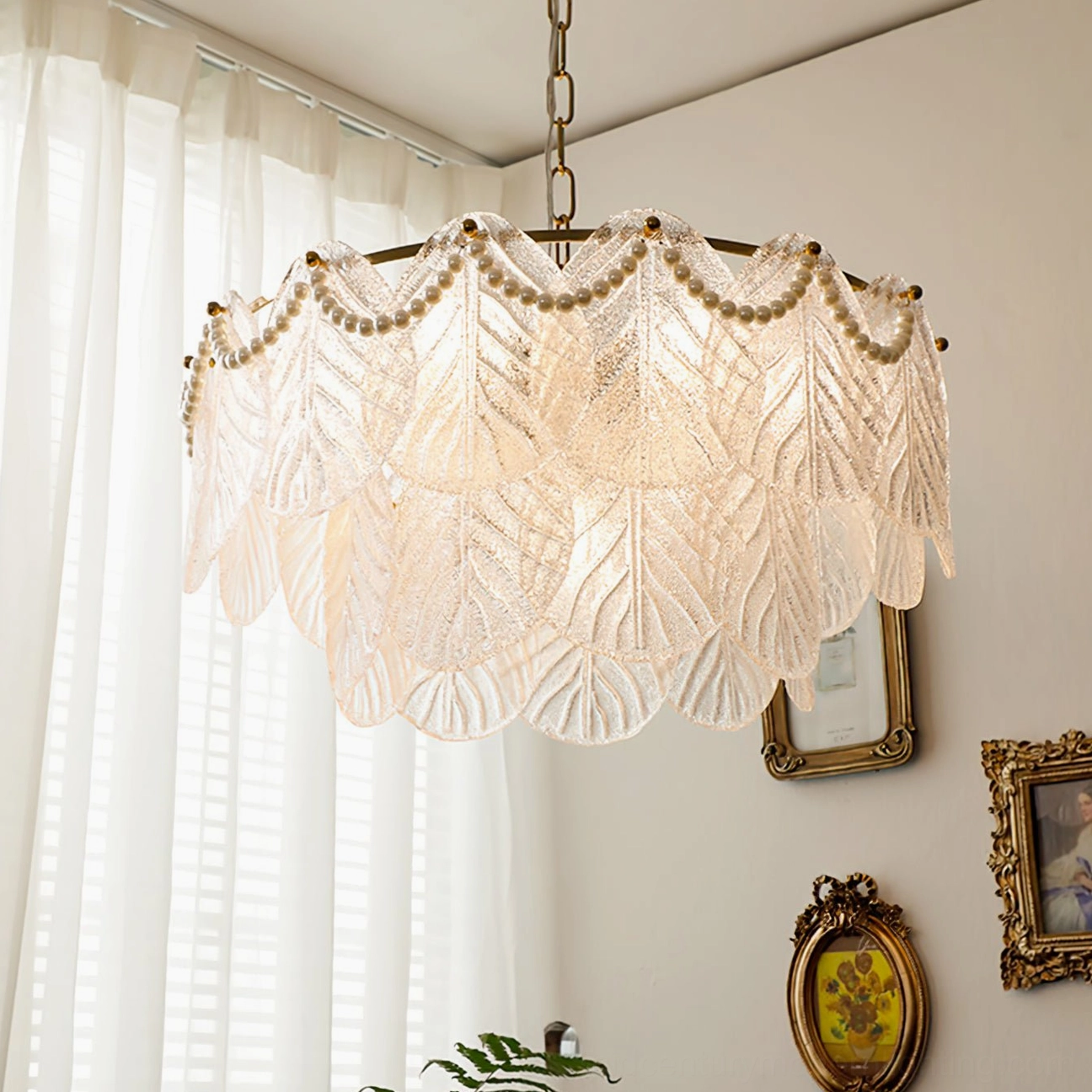 Compact two-layer frosted glass leaf pendant lamp with brass accents in bedroom or study setting, intimate mid-century modern lighting solution