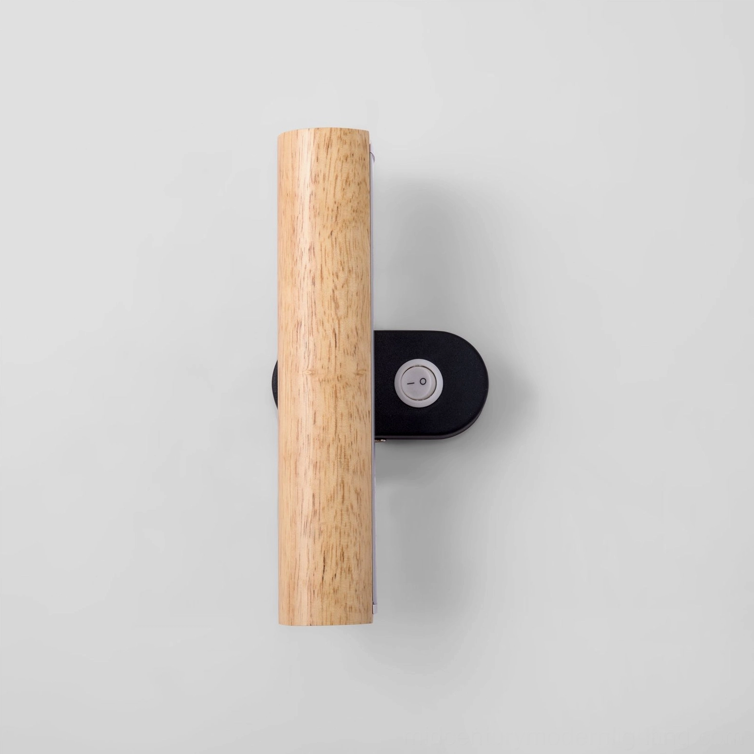 Compact vertical rotatable tube wall lamp with round control button on black metal base, front flat view