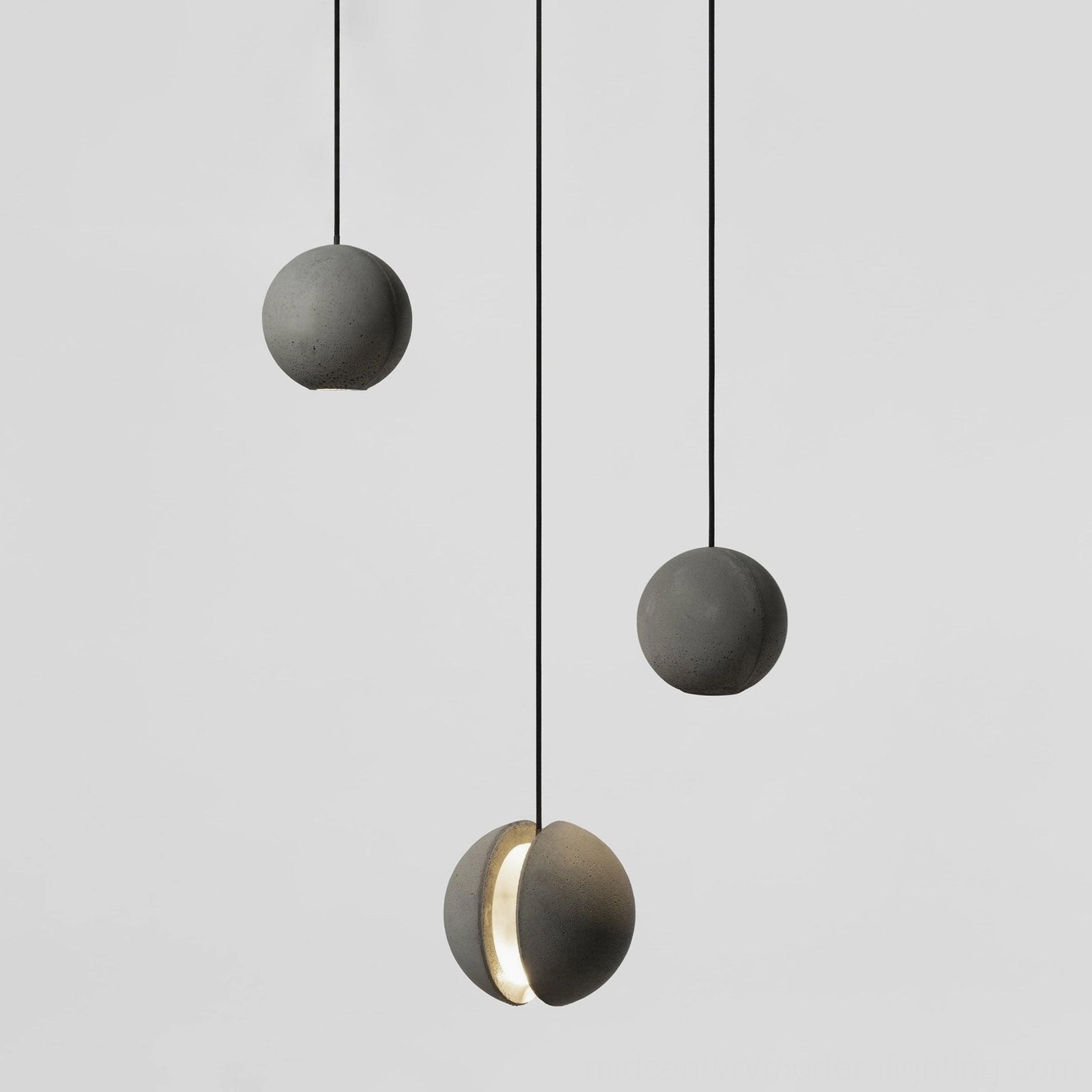 Concrete pendant lamp detail highlighting aluminum and acrylic components with cement shade