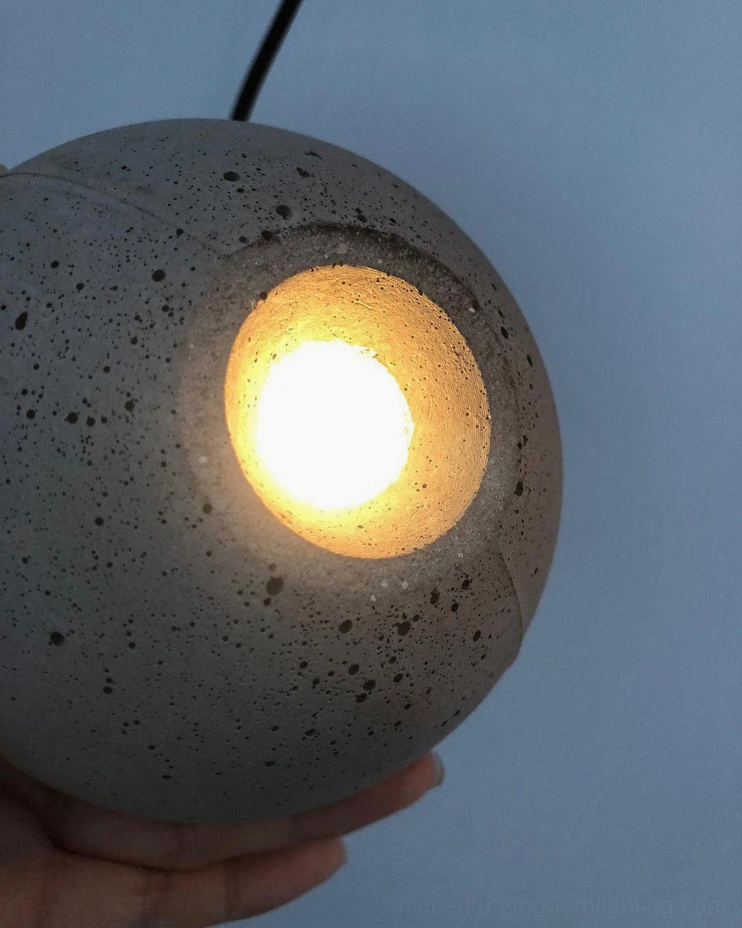 Concrete pendant lamp demonstrating versatile styling in contemporary home interior environment