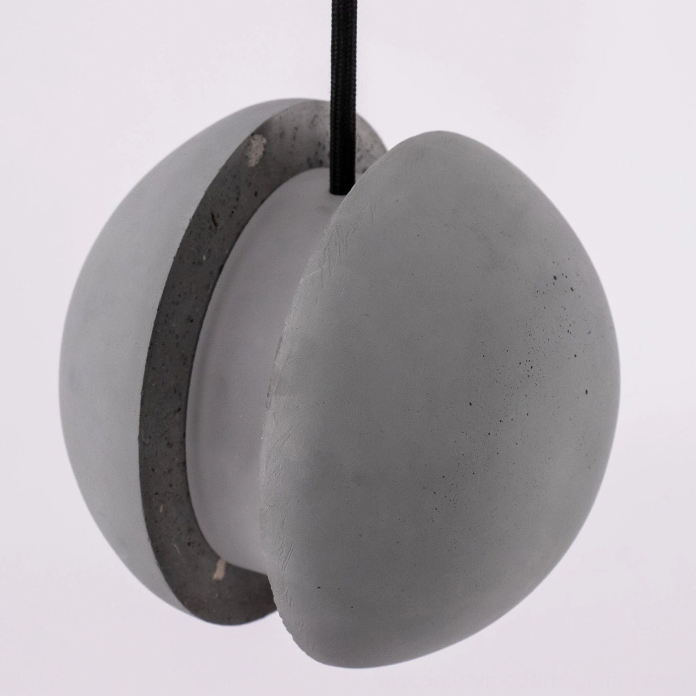 Concrete pendant lamp with warm Edison bulb option creating vintage aesthetic and ambiance