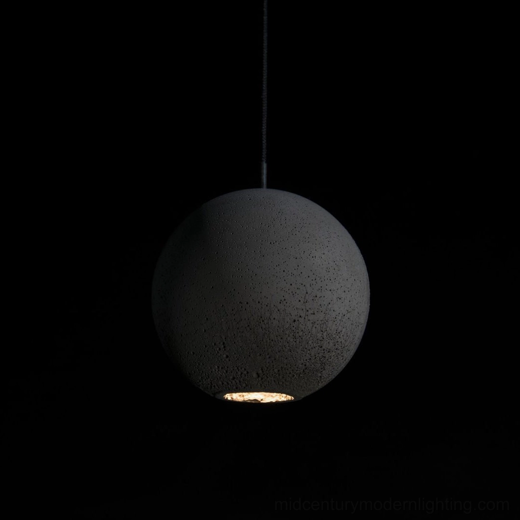 Close-up detail of concrete pendant lamp showing raw material texture and casting quality