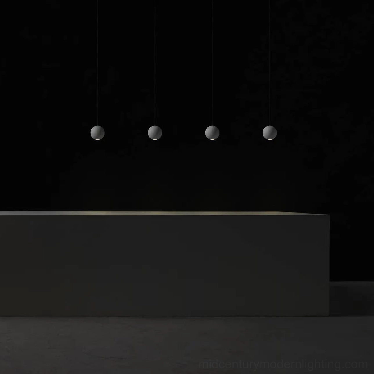 Concrete pendant lamp detail shot emphasizing matte grey finish and sculptural form on plain background