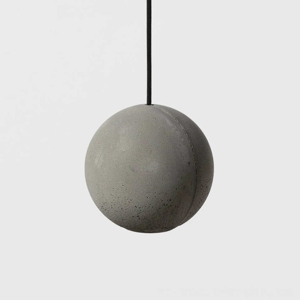 Solid spherical concrete pendant lamp with smooth matte grey finish and black suspension cord, front view