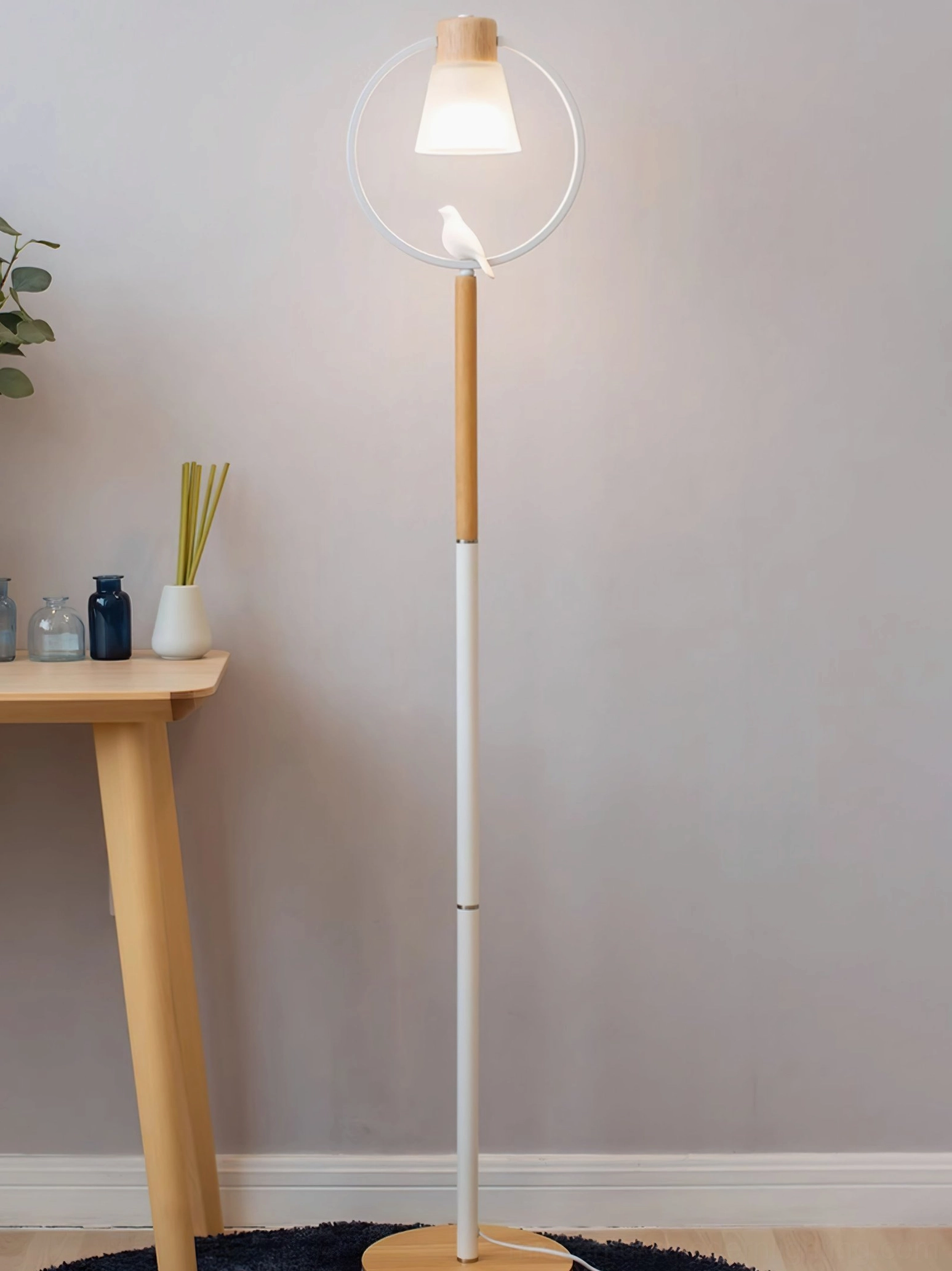 Cone arc floor lamp full view against plain wall showcasing Scandinavian minimalist design aesthetic