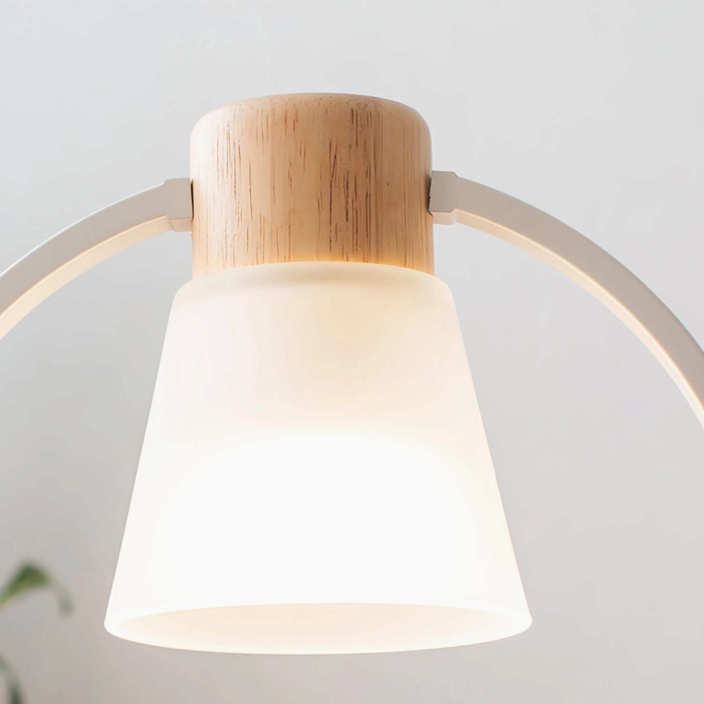 Close-up detail of cone floor lamp frosted glass shade with white and wooden metal frame components