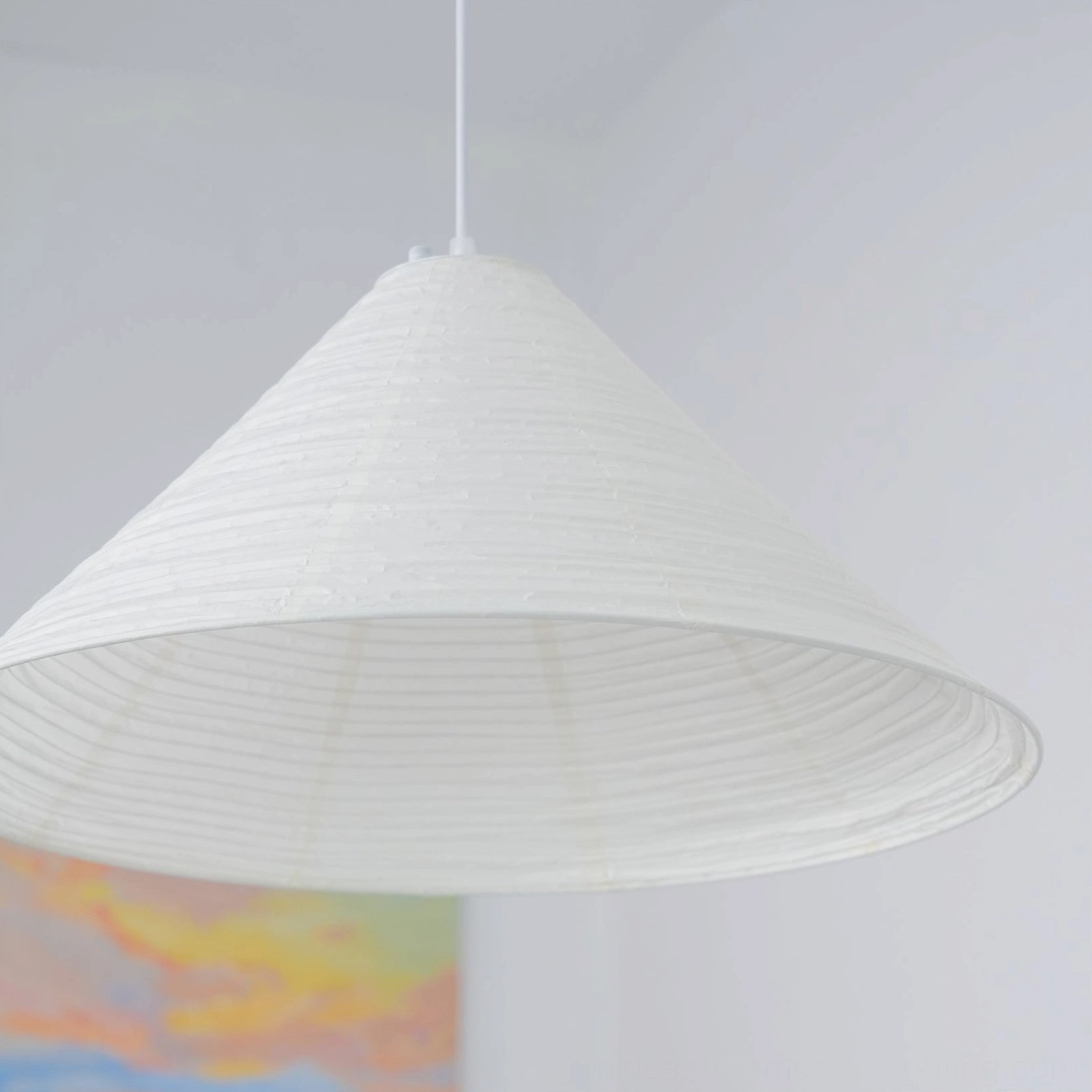 Wide-brim Cone Washi Pendant Lamp with pure white matte ribbed texture in minimalist indoor space