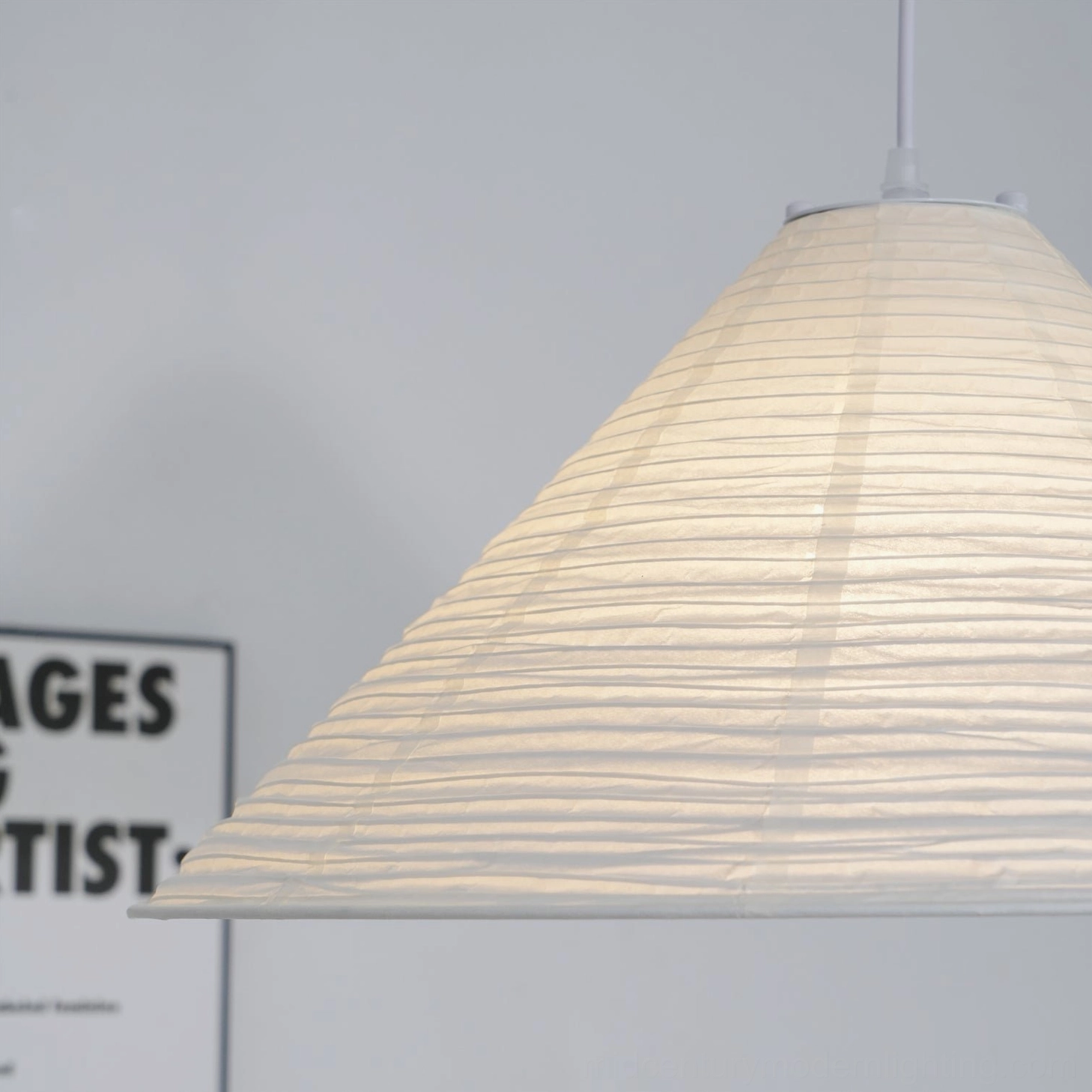 Close-up low side angle of Cone Washi Pendant Light showing dense horizontal ribbed paper texture and craftsmanship