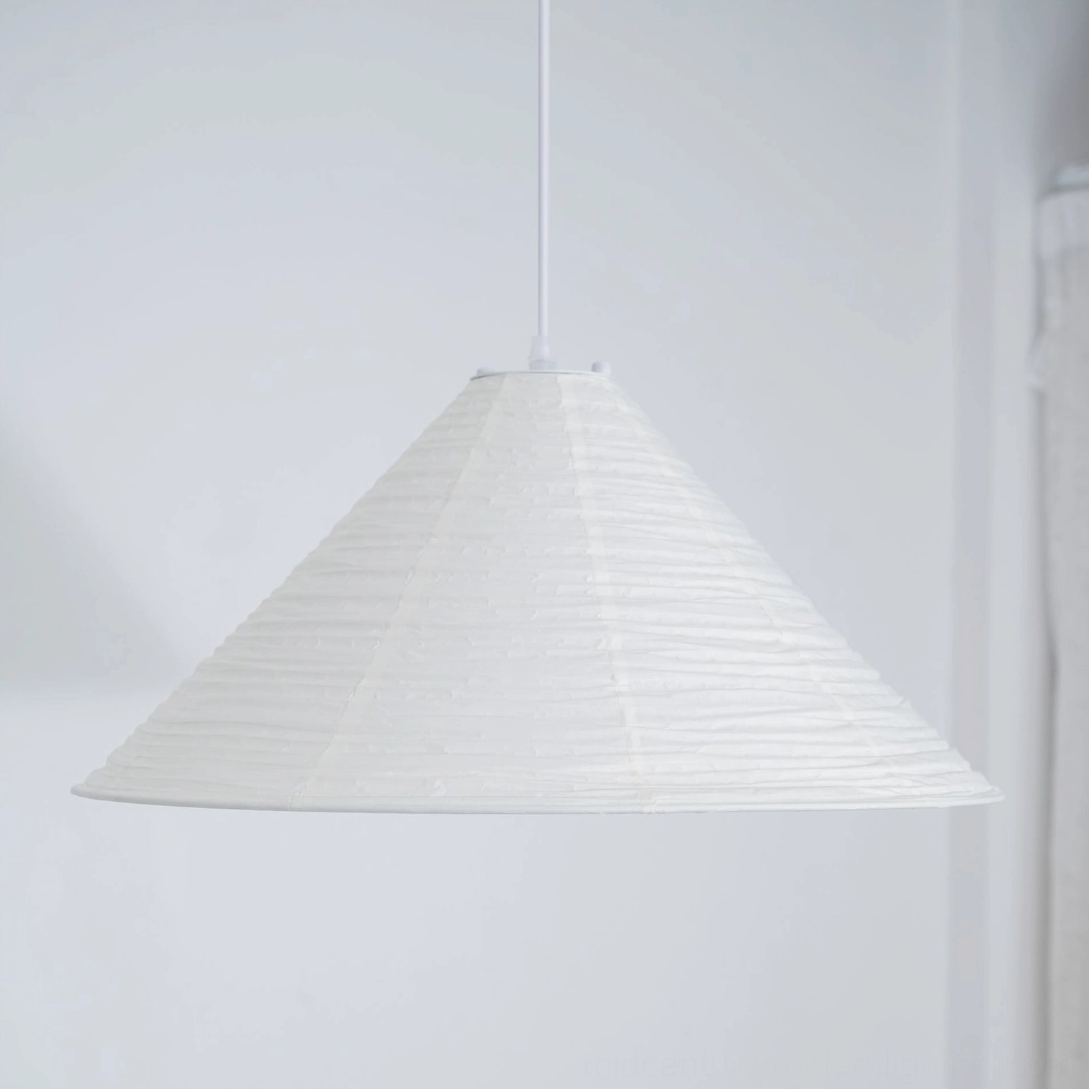 Cone Washi Pendant Light in neutral interior setting demonstrating soft diffused ambient lighting from rice paper