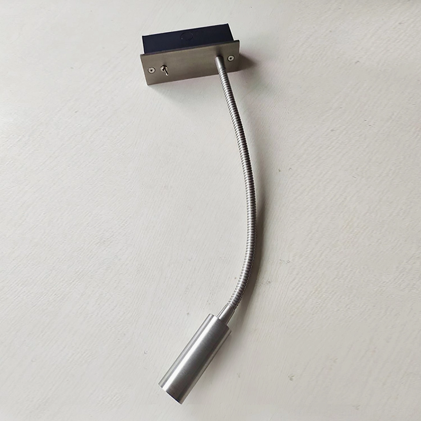 Contemporary adjustable LED wall sconce gooseneck, brushed bronze finish detail