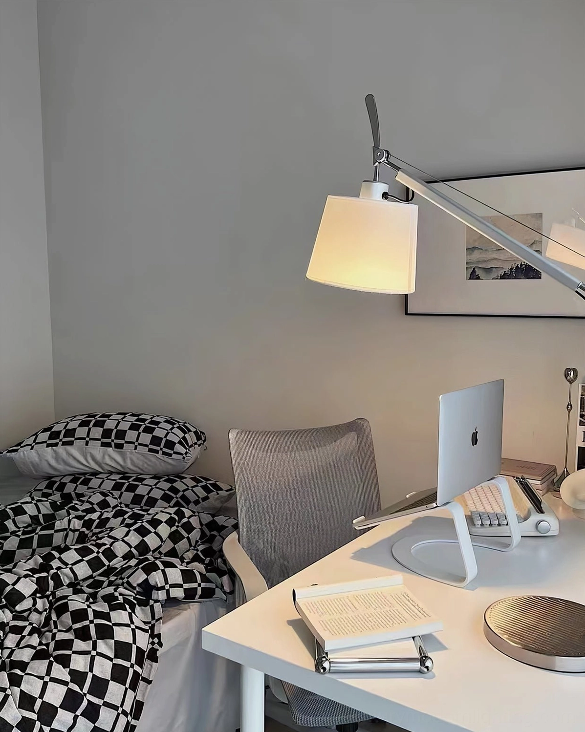 Contemporary articulating floor lamp with extended reach arm, silver metal construction for modern interiors