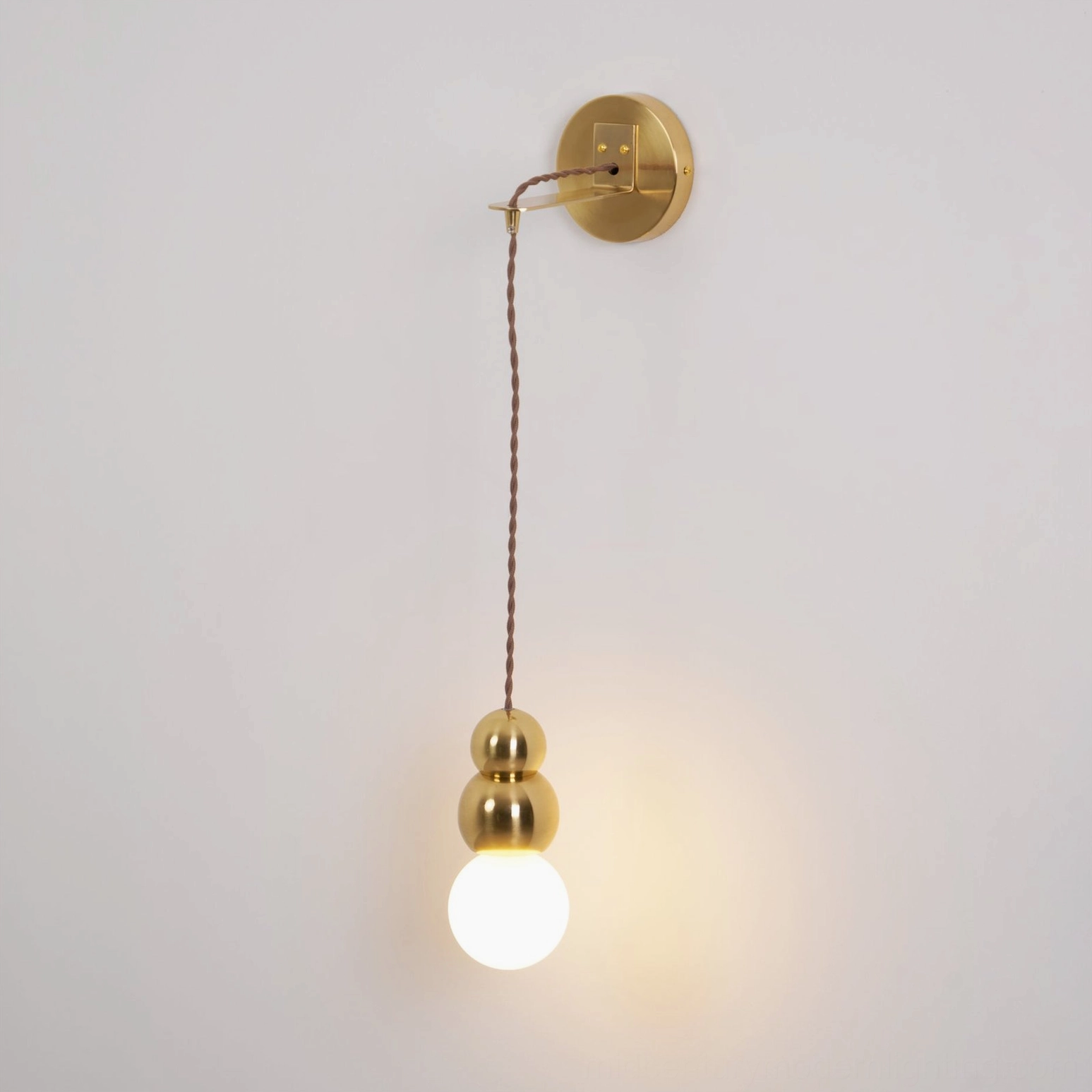 Contemporary ball wall sconce with Edison bulb glow, vintage-modern lighting aesthetic, warm ambiance