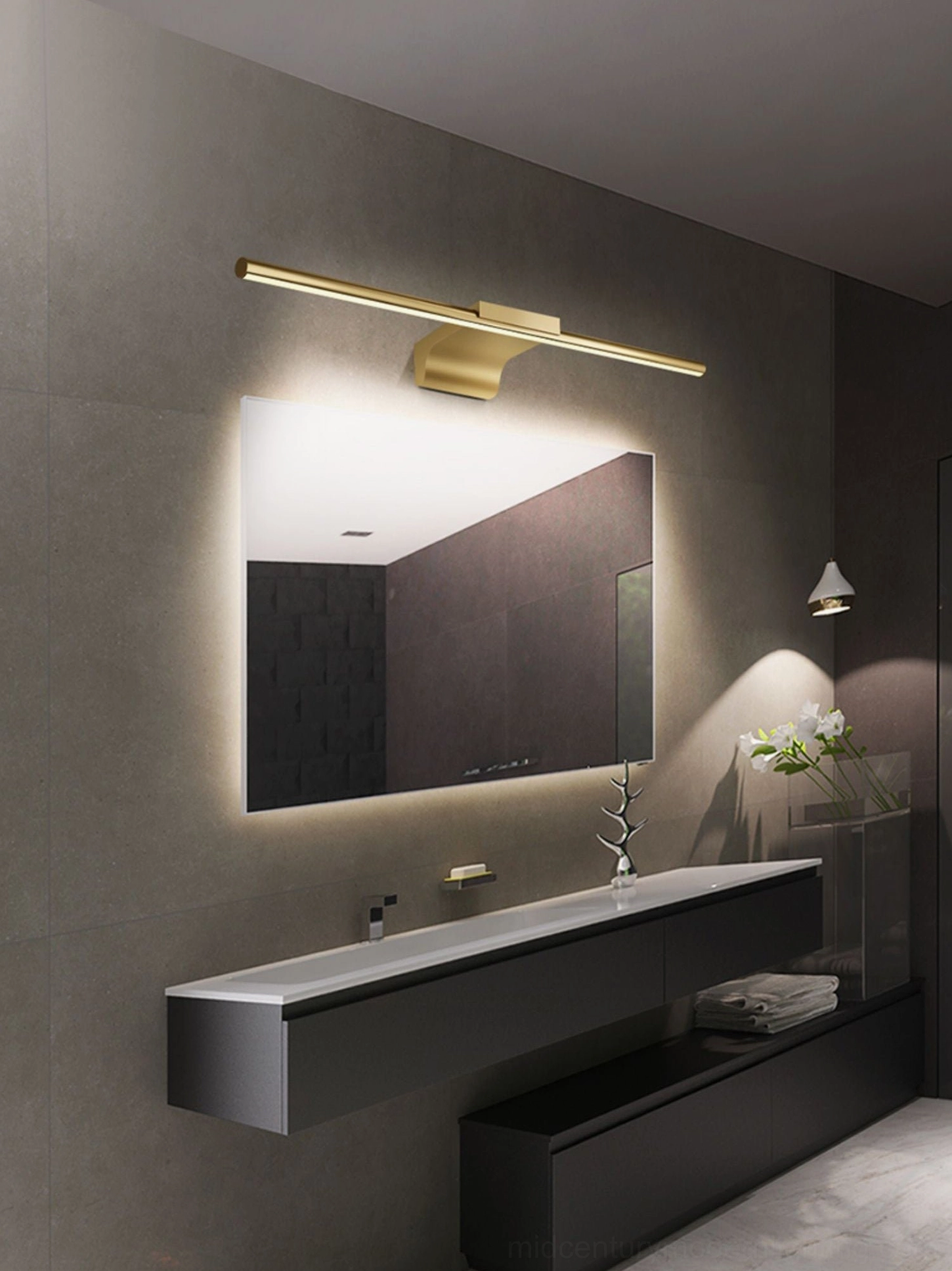 Contemporary bathroom with wall-mounted brass vanity lamp creating ambient lighting