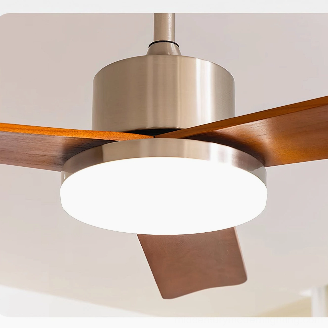 Contemporary ceiling fan light fixture detail showcasing brushed chrome accents and walnut wood material craftsmanship