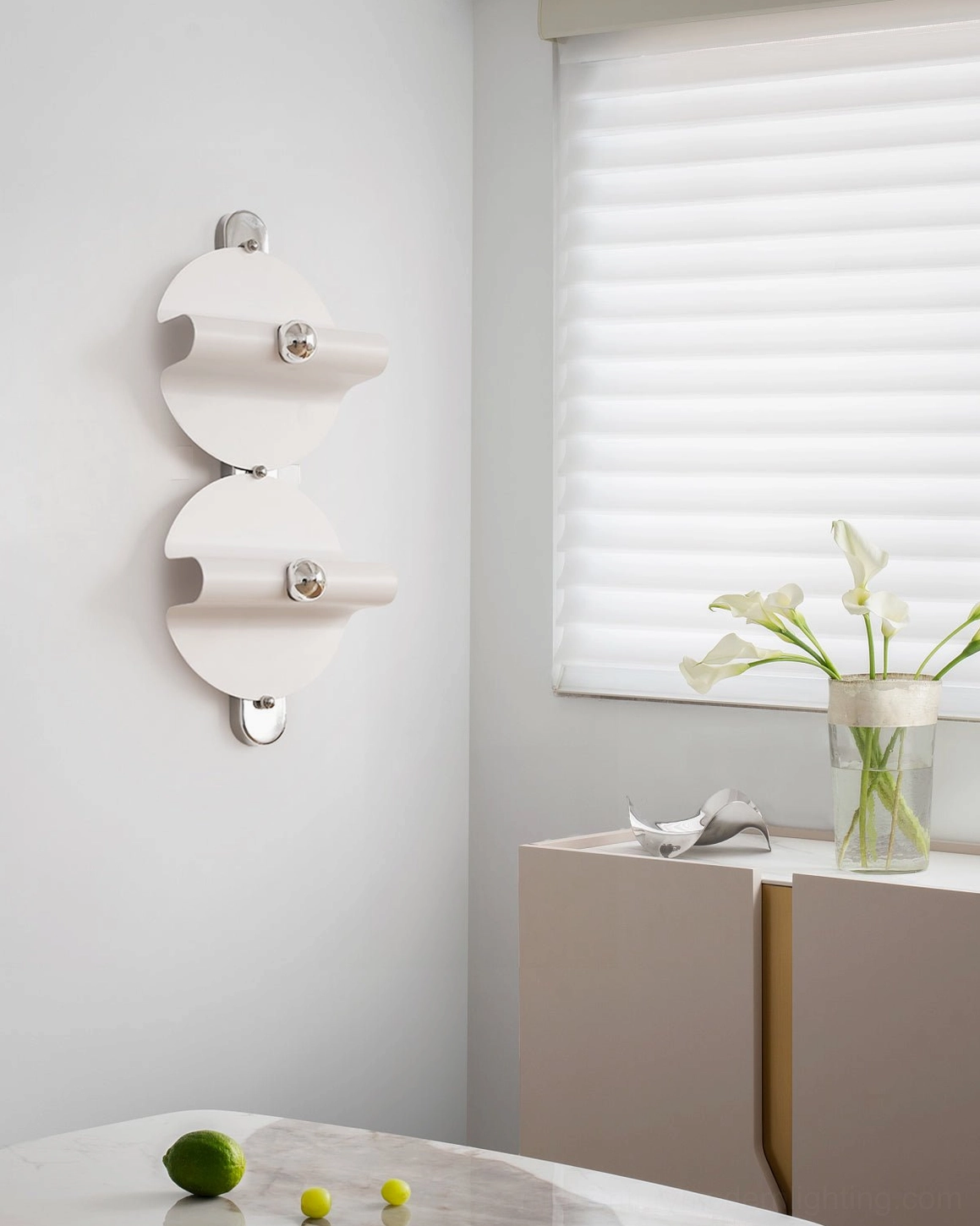 Pair of modern wall lamps installed on neutral wall in minimalist room setting with window blinds