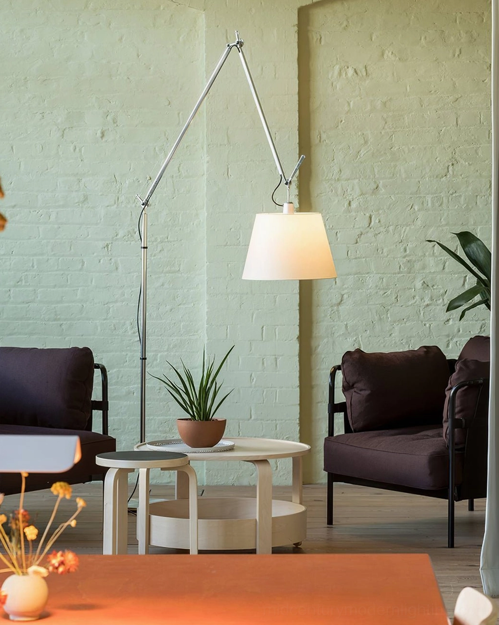 Contemporary floor lamp with extended swing arm mechanism, silver metal frame and neutral shade colors