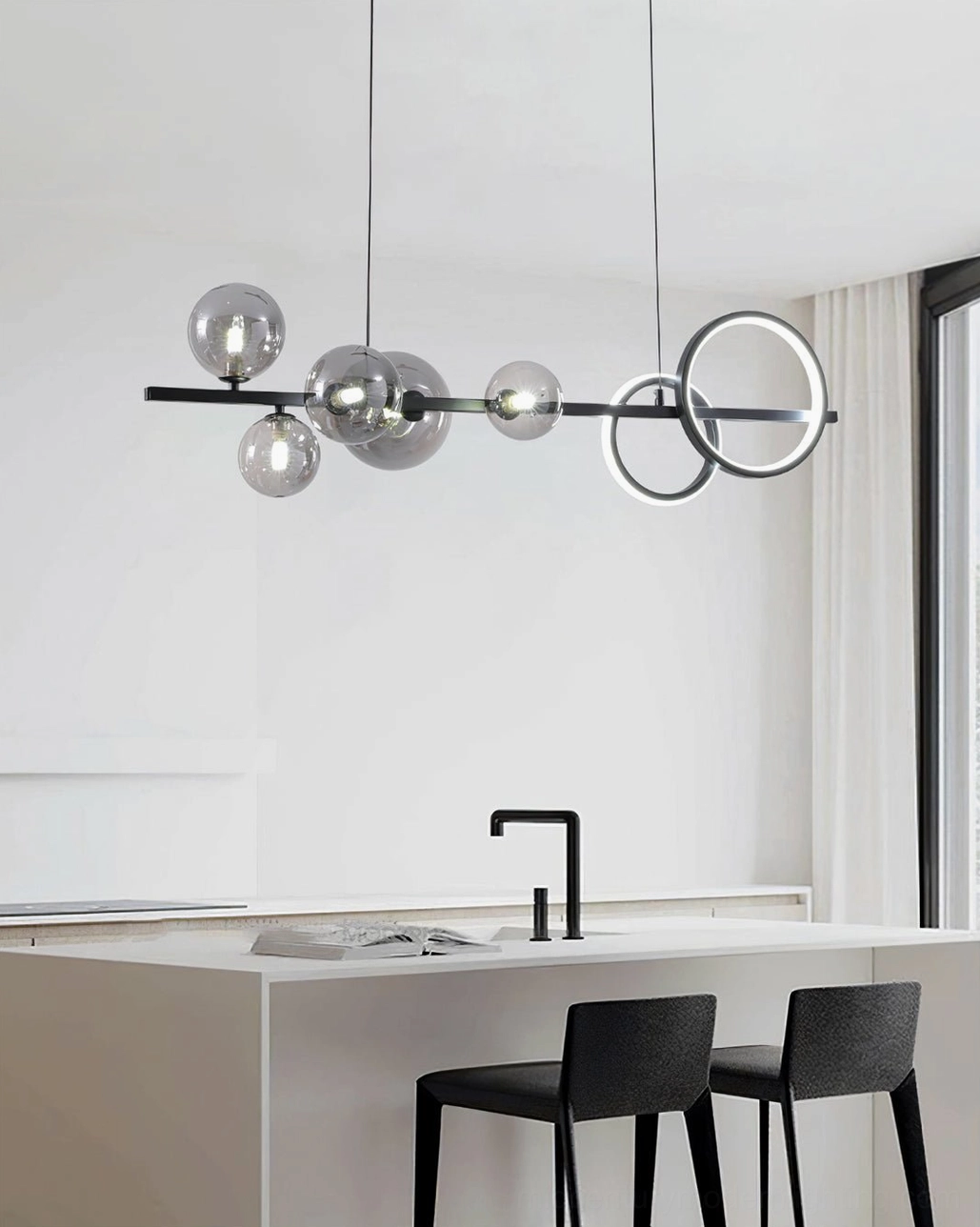Contemporary glass bubble pendant light with clear orbs and dual circular LED rings in minimalist white kitchen area
