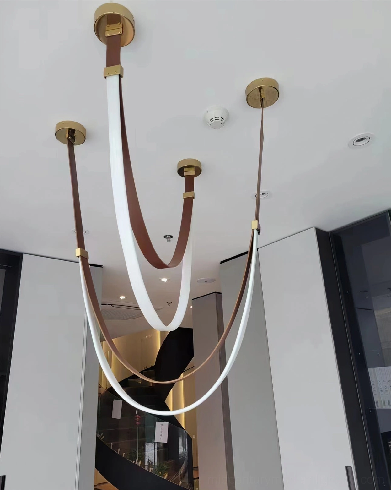 Contemporary pendant lamp with leather construction demonstrating detailed craftsmanship and material quality