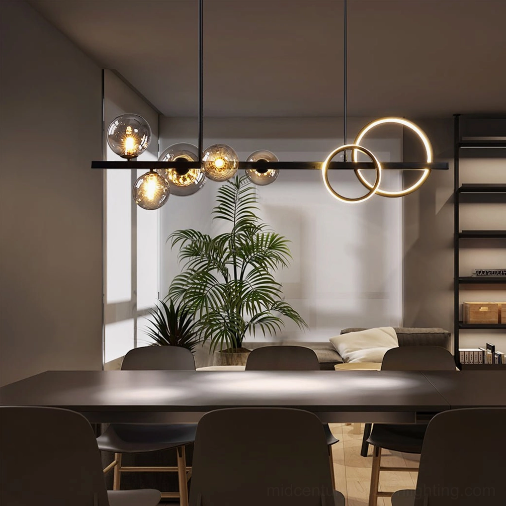 Contemporary linear pendant chandelier with clear glass bubbles and dual LED rings in styled interior room setting