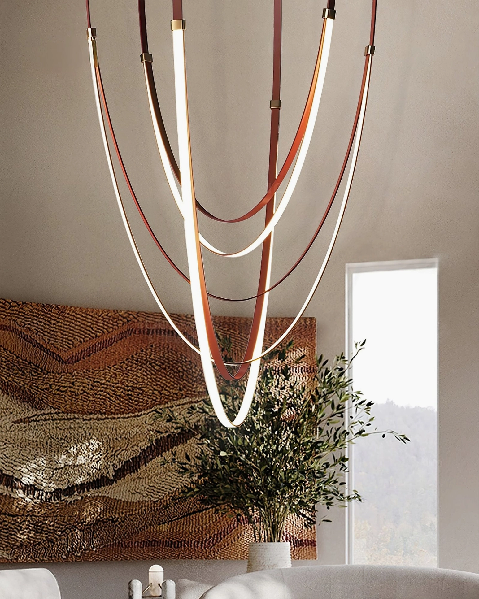 Modern linear pendant lamp with dual-tone leather straps and warm LED lighting in contemporary living room setting