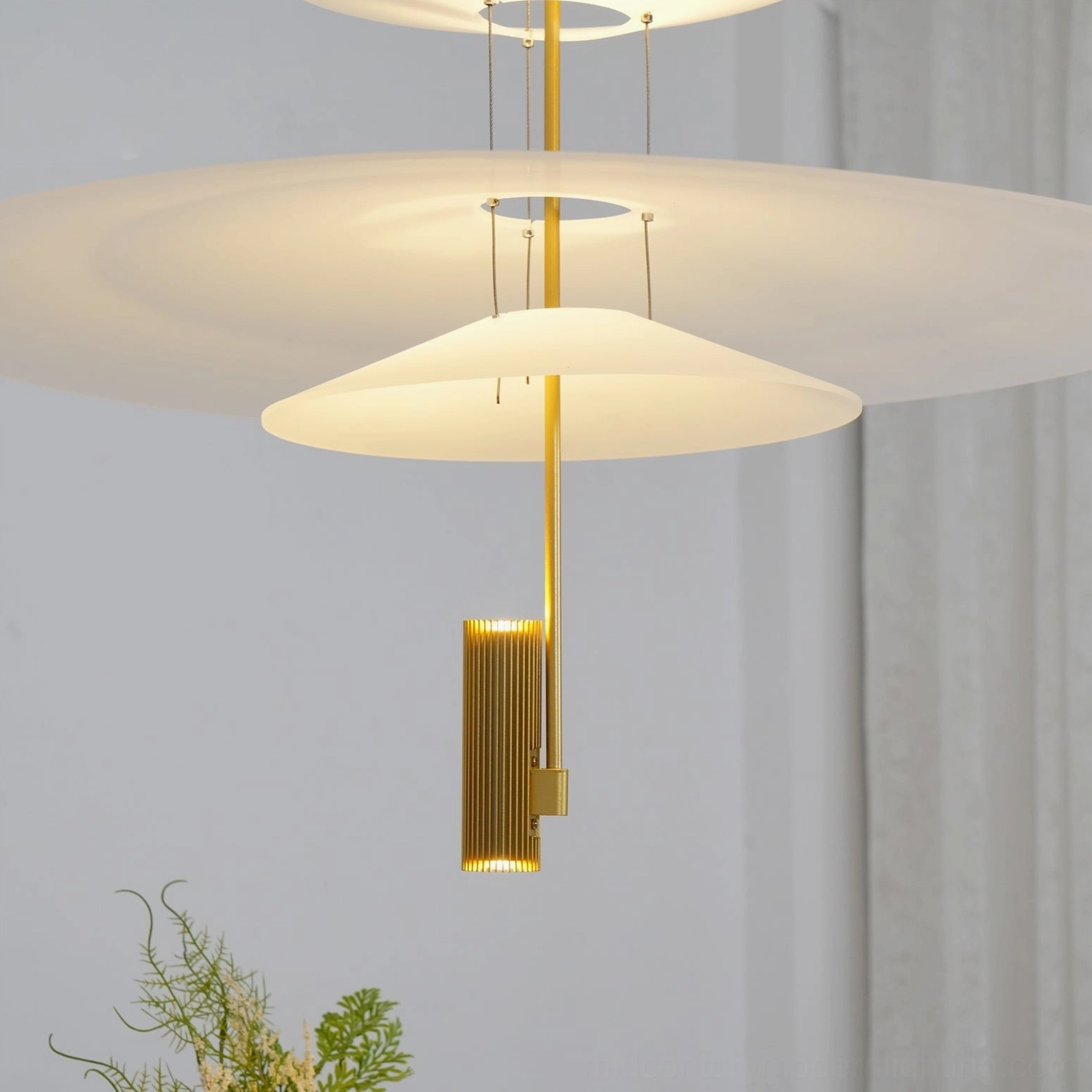 Contemporary living room pendant fixture installation over modern furniture with clean-lined design