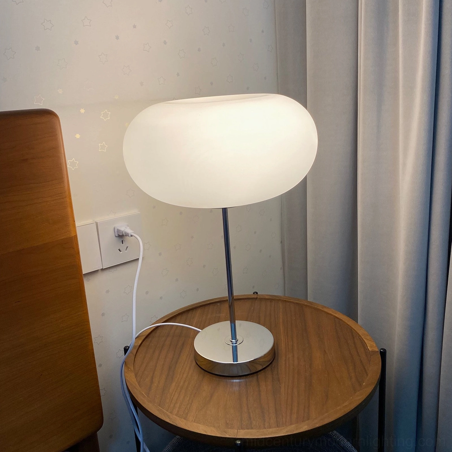 Contemporary minimalist table lamp with soft ambient glow, interior design styling
