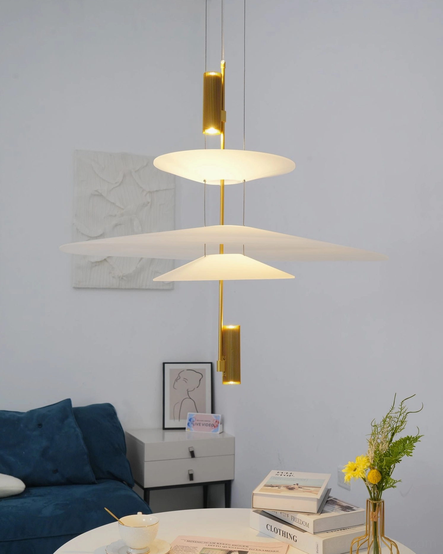 Contemporary ceiling pendant with integrated LED providing ambient lighting in modern living area