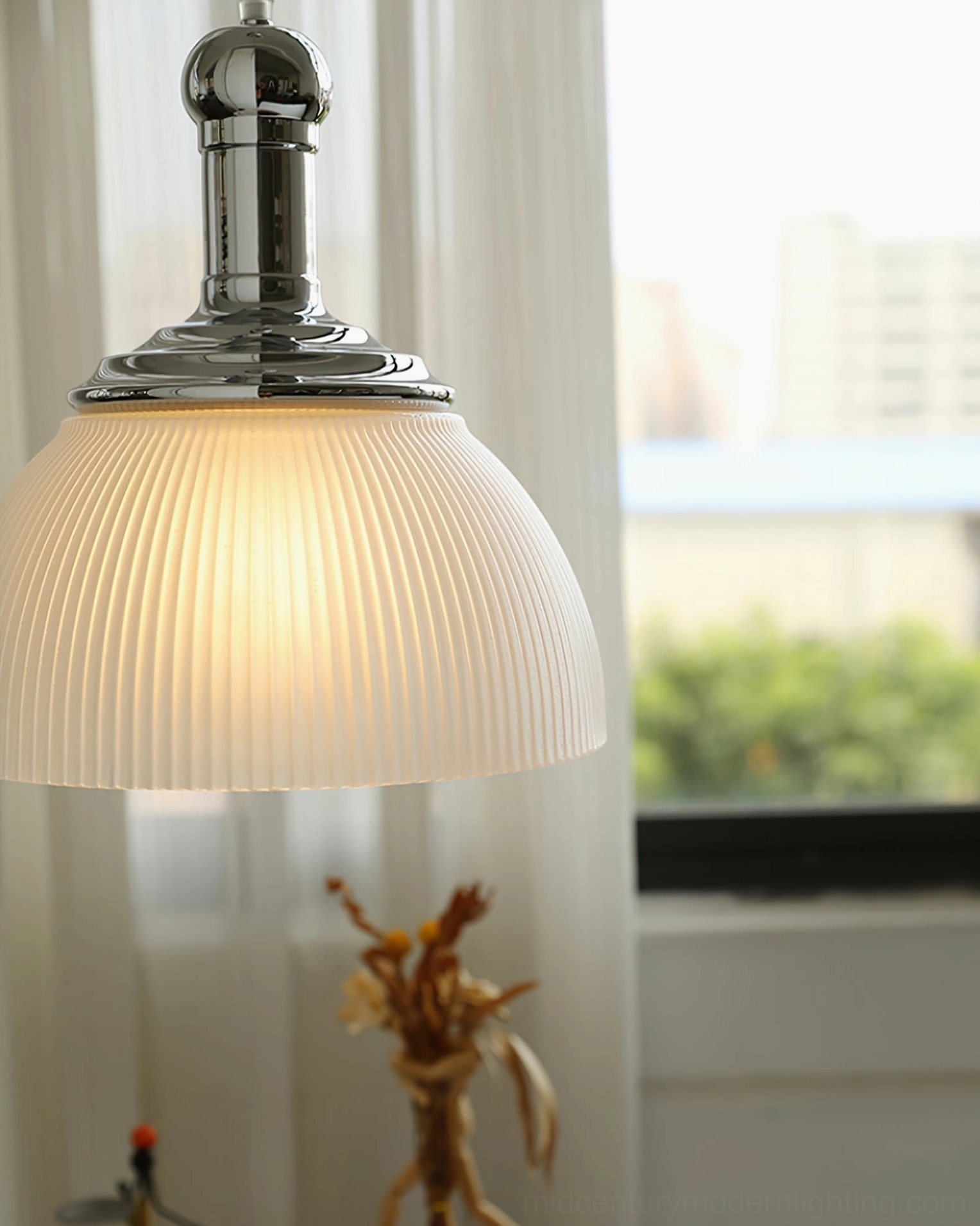Contemporary ribbed glass pendant lamp installation showing modern interior design application
