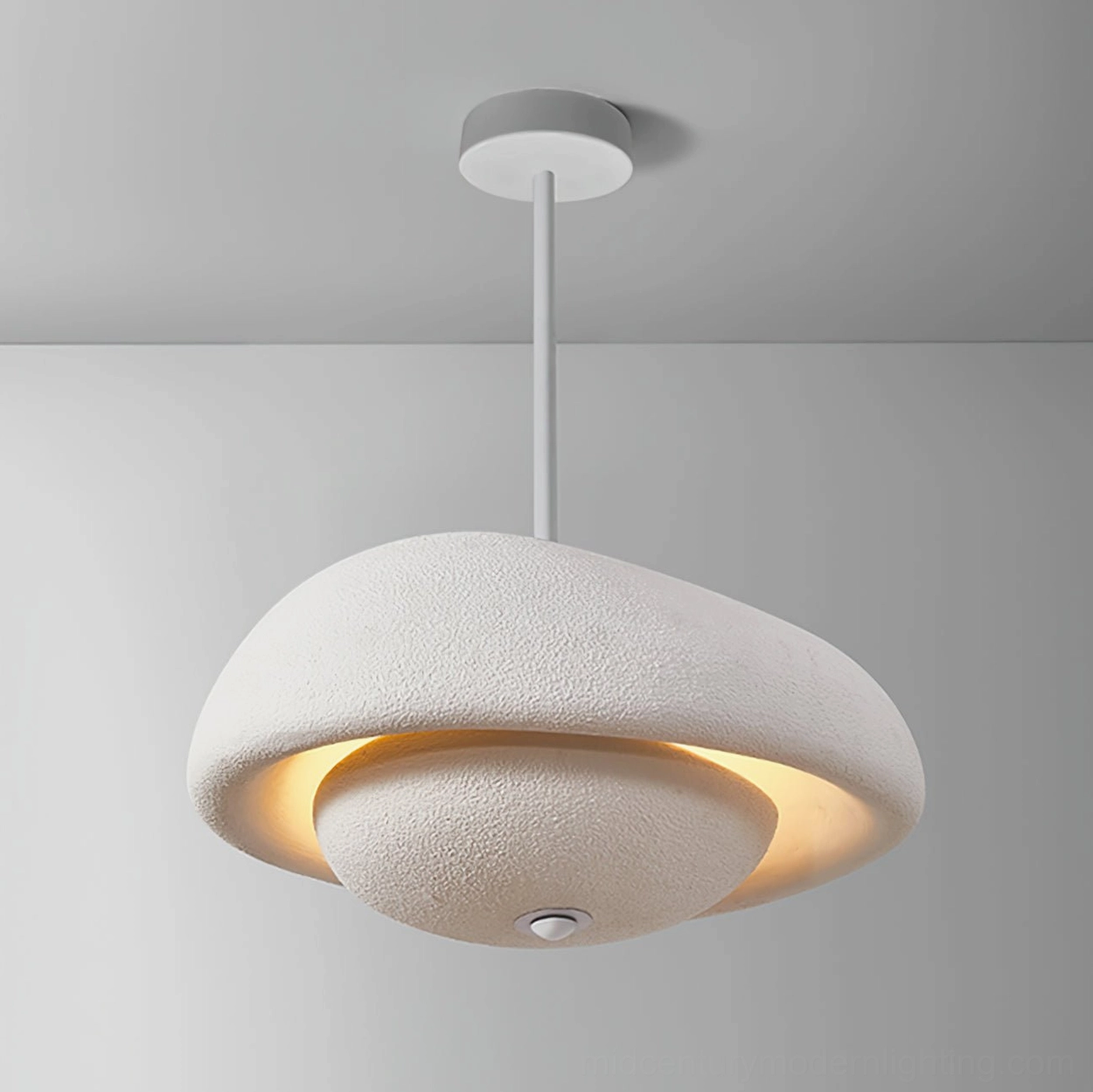 Contemporary sculptural pendant light with textured resin surface and sophisticated matte finish