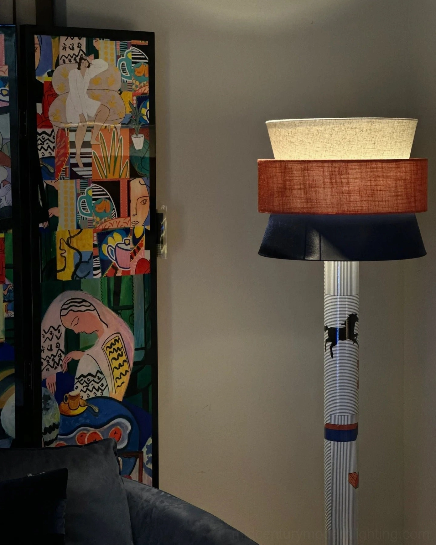 Contemporary standing lamp with blue and orange color options and artistic printed design elements on display