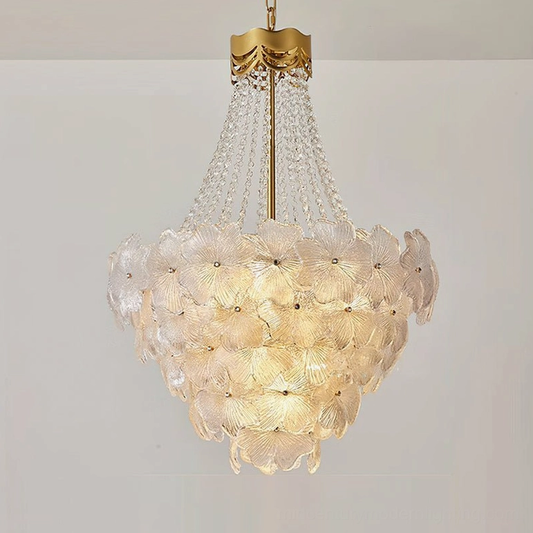 Close-up detail of frosted glass petals and crystal bead strands on Corinthian chandelier, white background