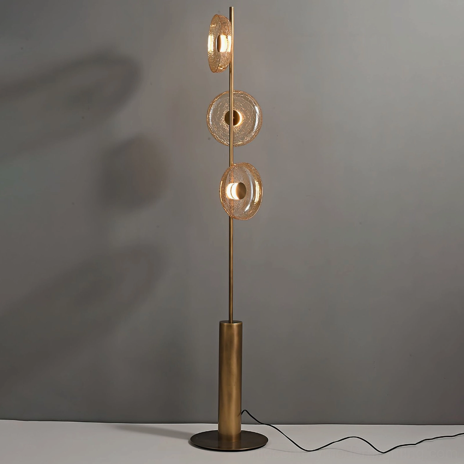 Ambient lighting showcase of crackle glass floor lamp creating atmospheric shadow patterns and warm glow