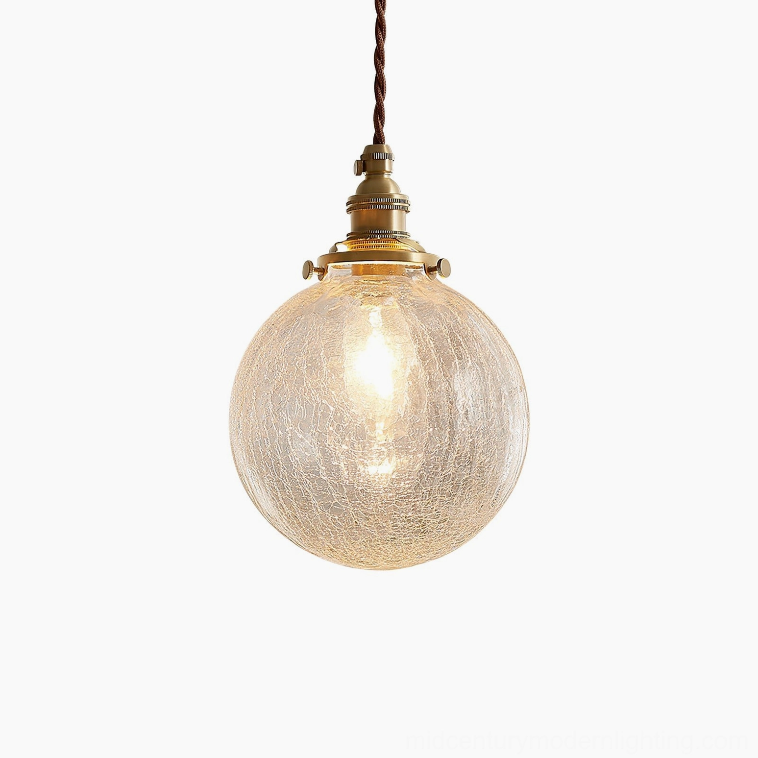 Crackle glass pendant light studio product photography showing complete fixture with brass hardware and crystalline glass globe