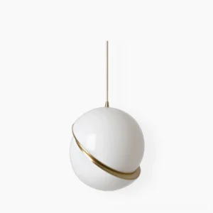 Crescent pendant light with opal white sphere and brushed gold fascia on white studio background