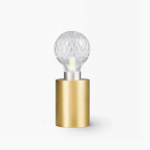 Handcrafted crystal bulb table lamp with brass base, hand-cut clear glass shade, frontal studio view