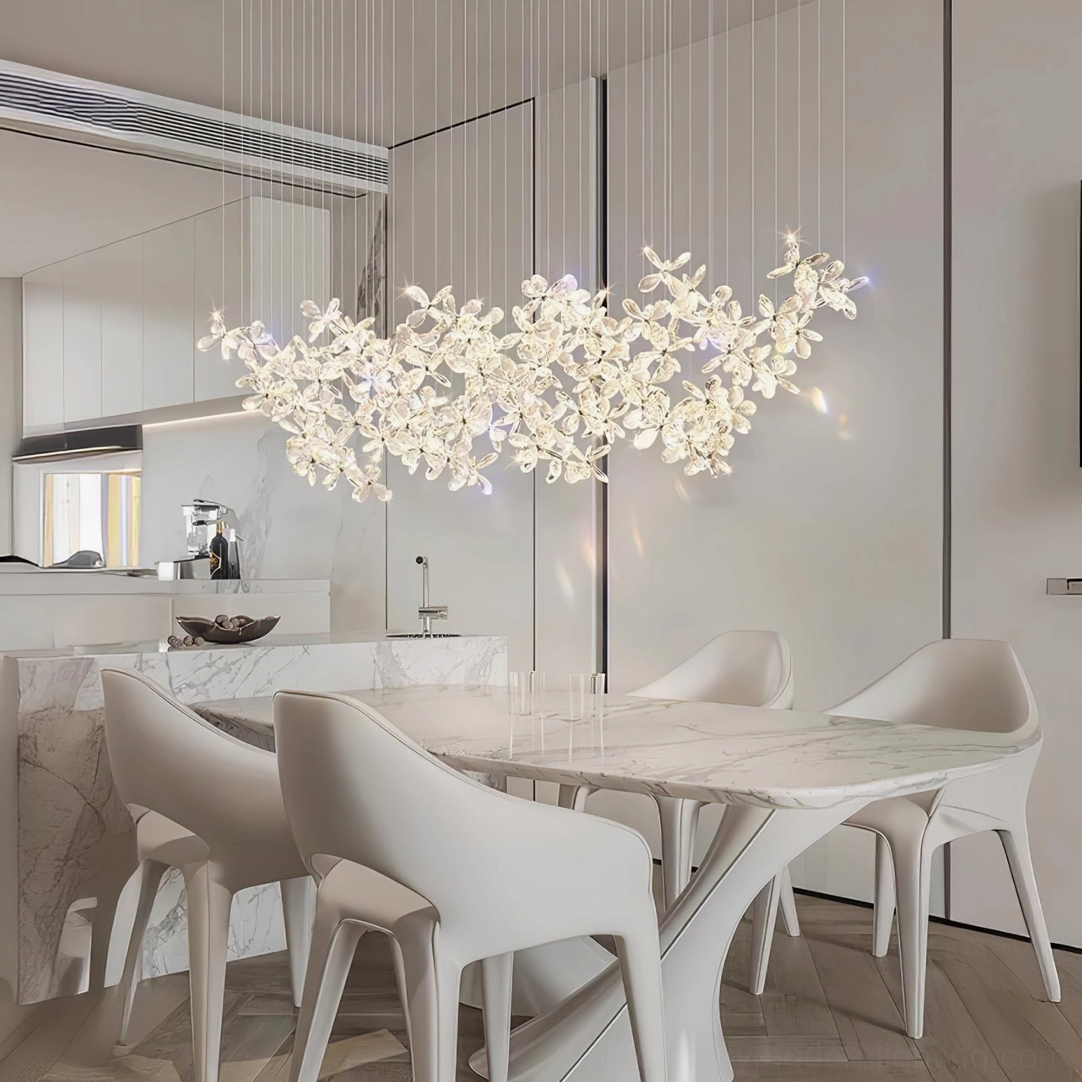 Crystal butterfly chandelier above marble dining table in modern white kitchen, contemporary LED fixture with crystal flower petals, neutral interior design