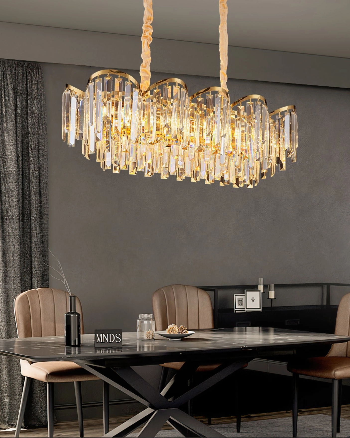Detailed view of crystal chandelier assembly showing crystal prism arrangement and gold metal structure