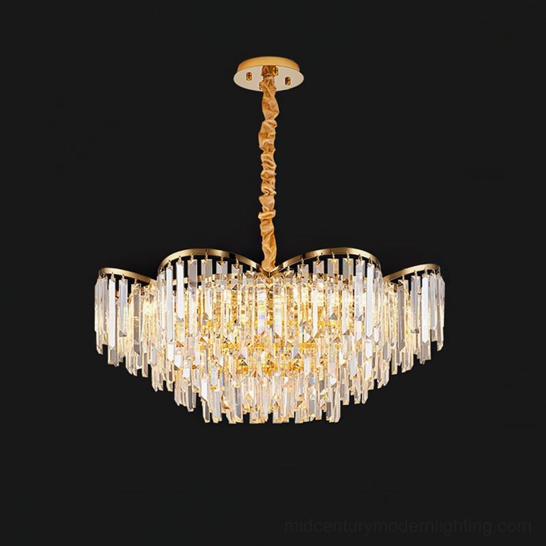 Crystal chandelier mounted in elegant entry hallway creating luminous focal point with geometric crystal pattern
