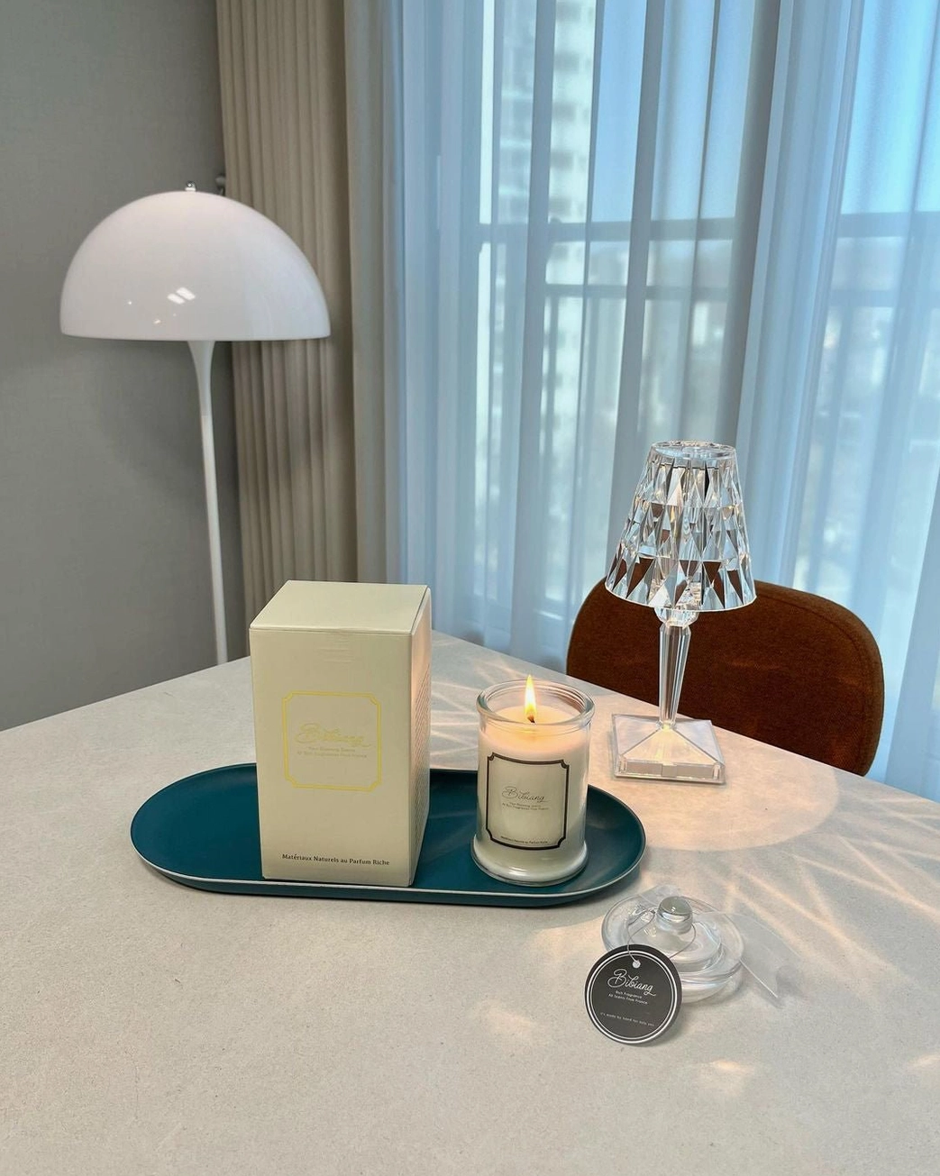 Crystal cordless table lamp in modern minimalist living room, transparent faceted design detail