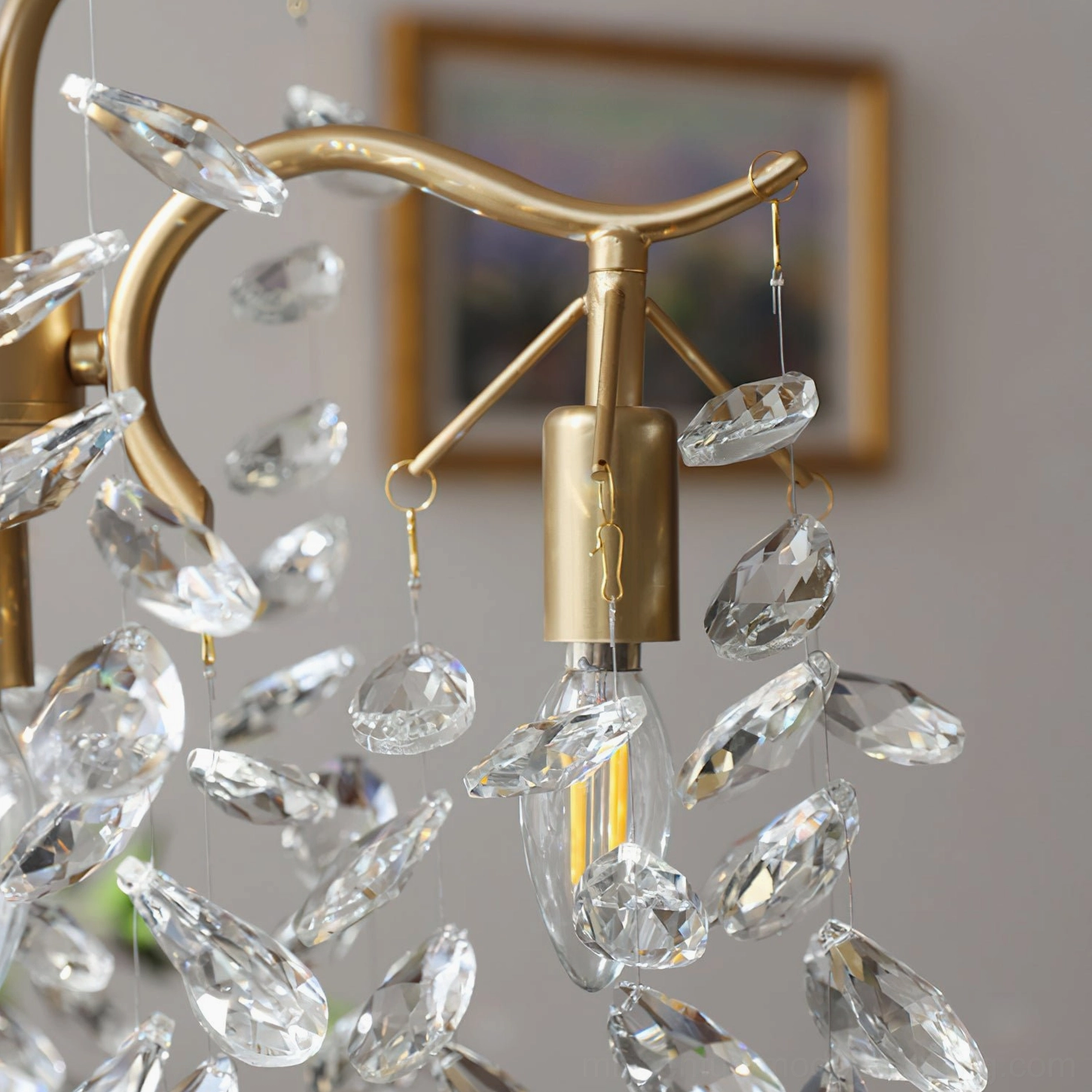 Brass crystal leaf chandelier socket detail with leaf-shaped glass pendants and mounted bulb holder, vintage indoor setting