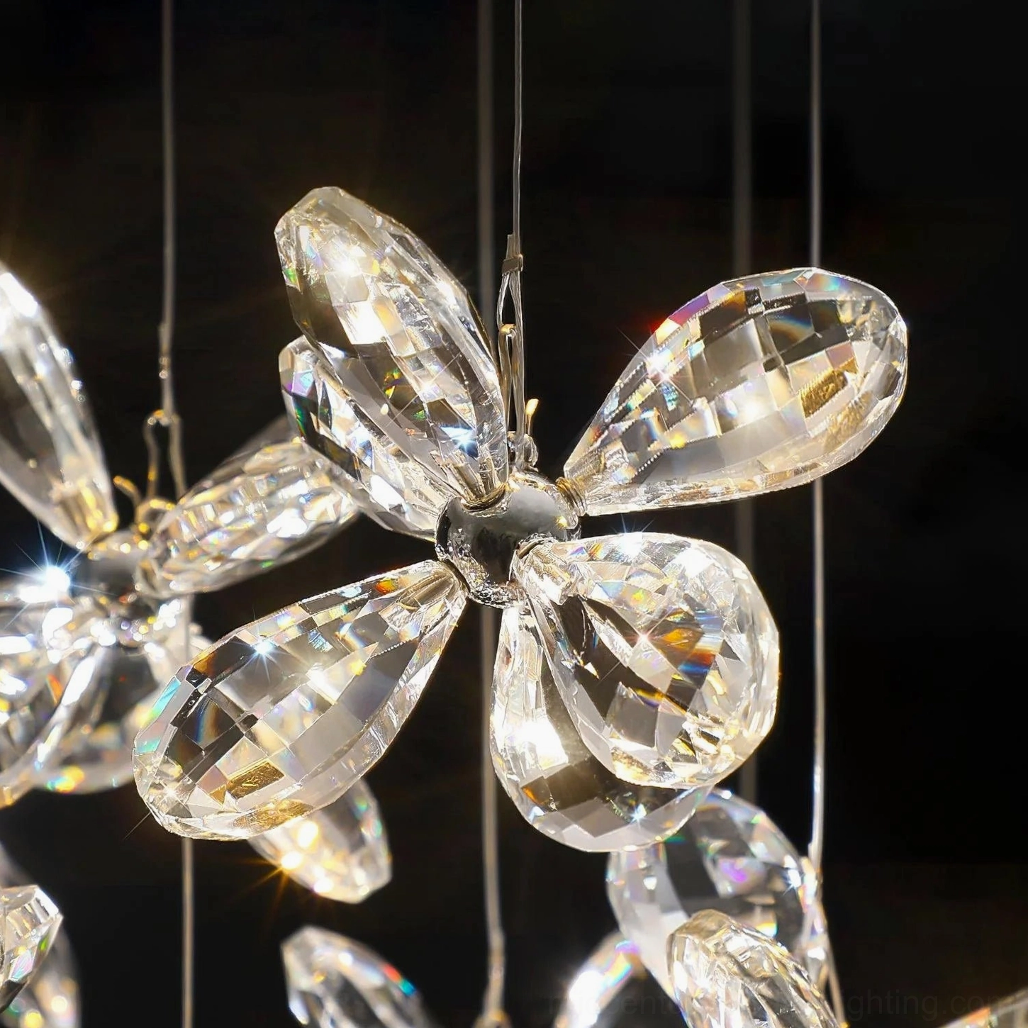 Crystal butterfly flower detail with glossy faceted crystal petals and central metal fixture, macro photography of chandelier pendant crystal craftsmanship