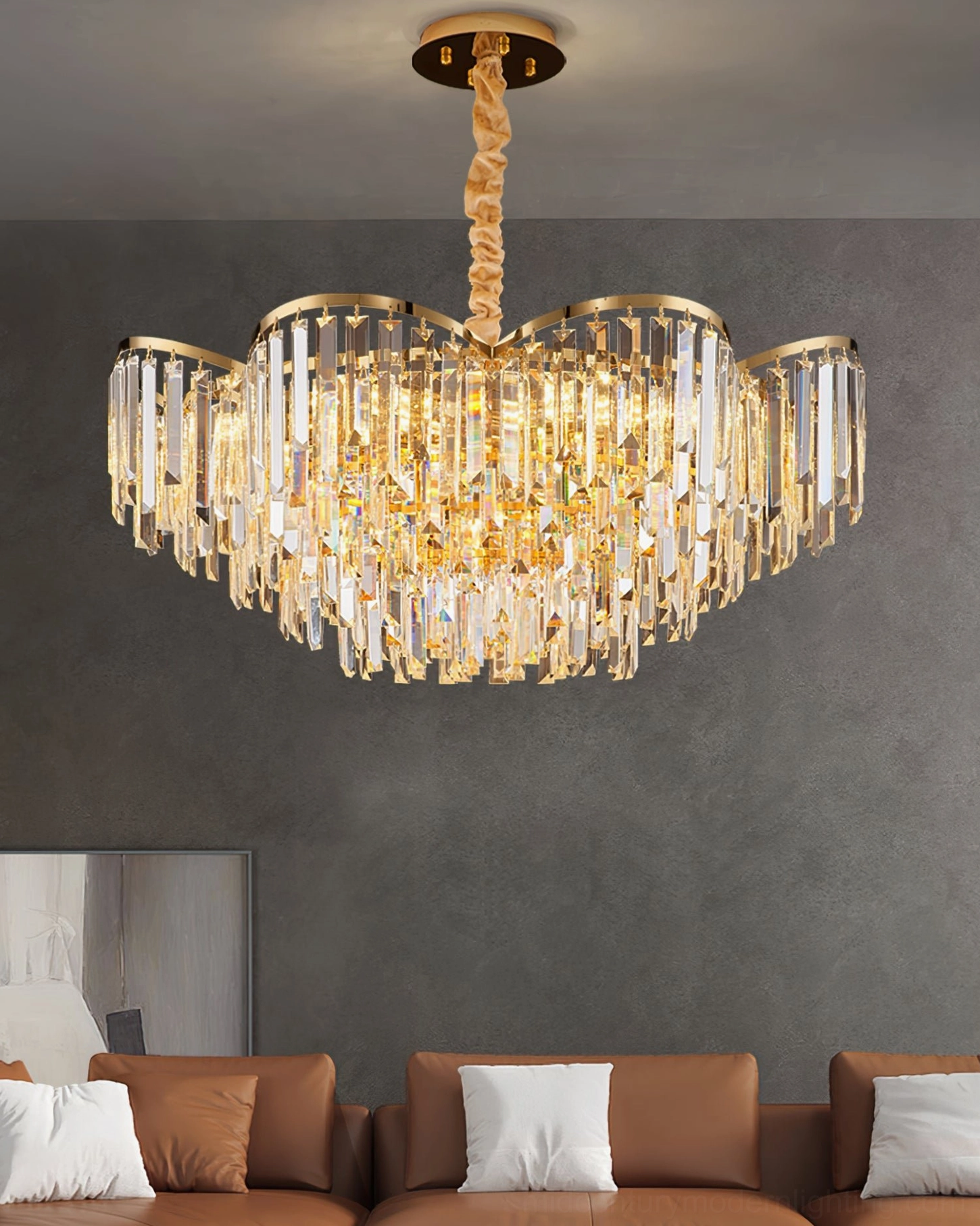 Abundant hanging crystal strands chandelier with gold metal frame in contemporary living room grey accent wall