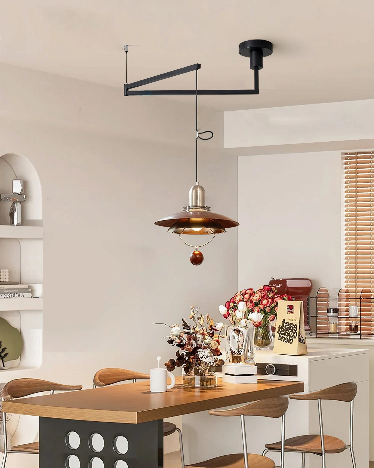 Retro swing arm pendant light in Nordic kitchen-dining area - warm-toned vintage lighting fixture in contemporary home