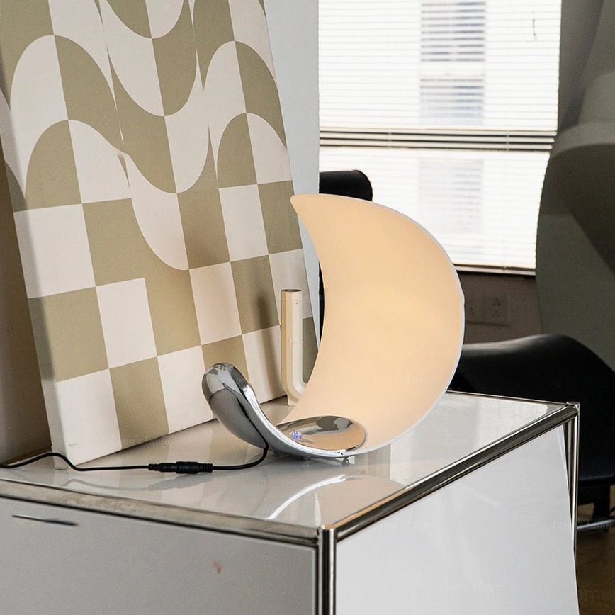 Curl crescent table lamp chrome finish polished surface reflection modern lighting