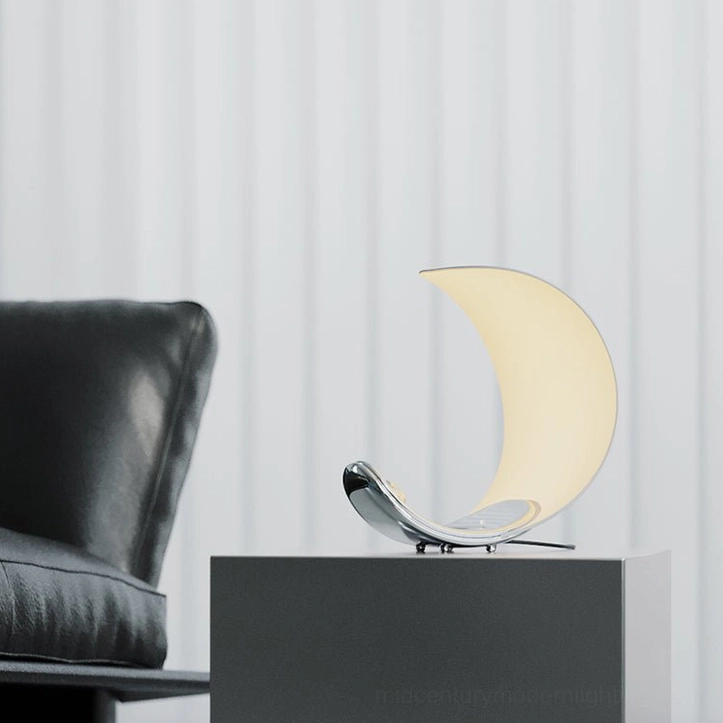 Curl crescent table lamp modern showroom leather sofa sleek minimalist decor setting