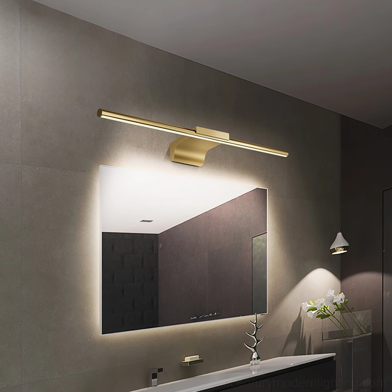 Master bathroom with curved brass wall lamp mounted beside large rectangular mirror