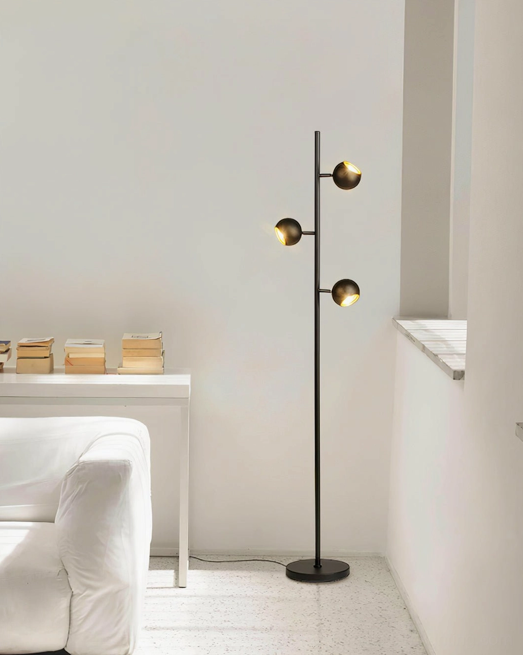 Dakota slim floor lamp in contemporary white living space with sofa and side table