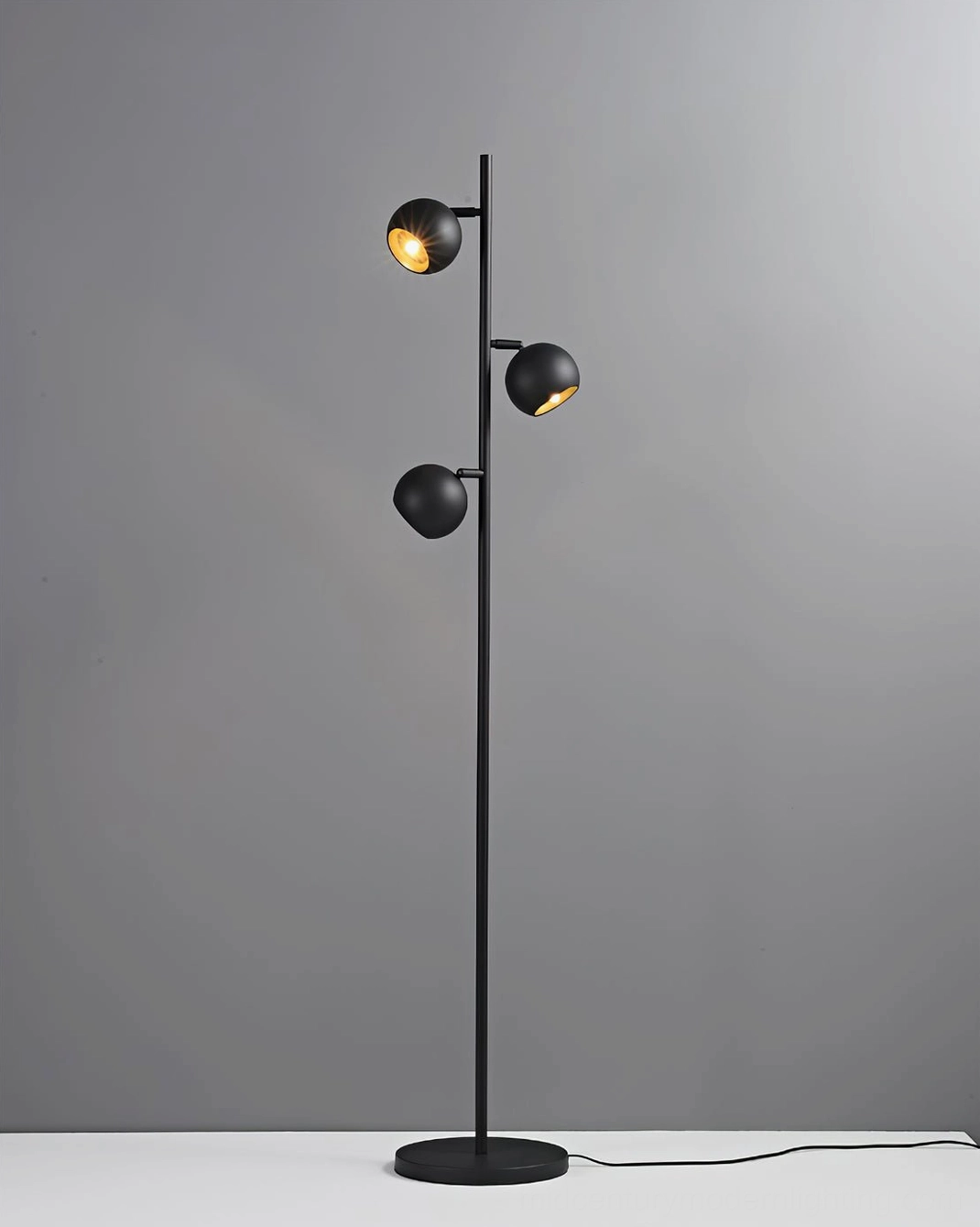 Dakota three-head floor lamp showing all three adjustable lamp heads and architectural form
