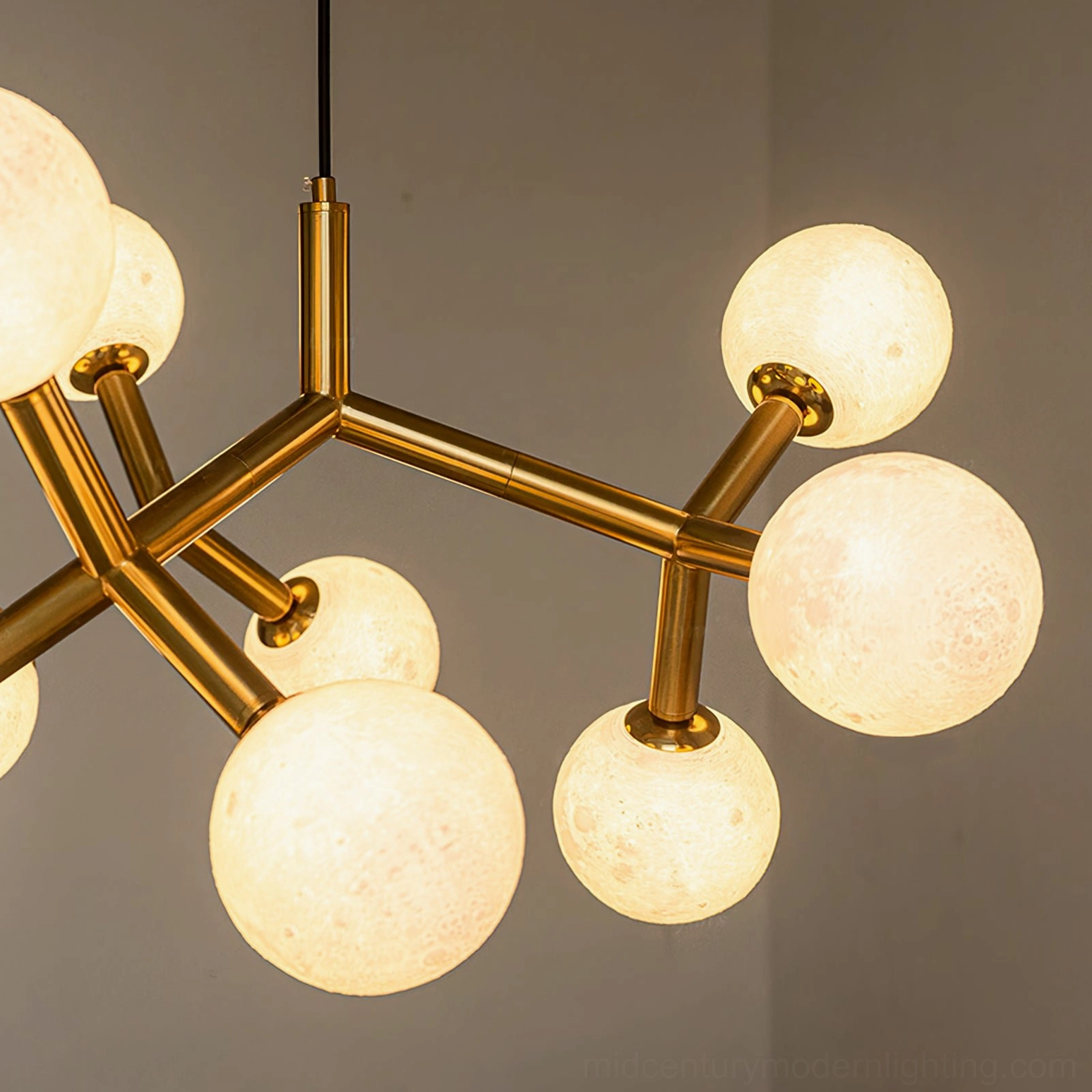 Dallas Planet front view with illuminated frosted moon globes and branch-style brass framework