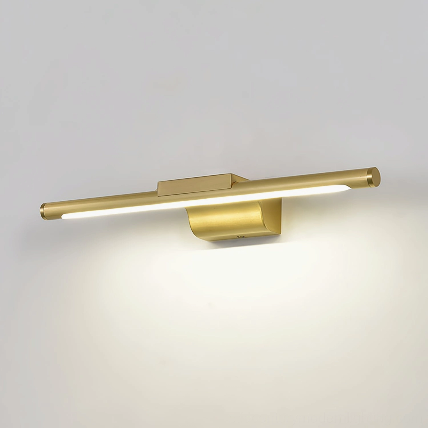 Designer bathroom wall lamp with sculptural brass design and ambient lighting